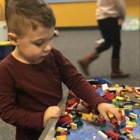 preschool student playing with legos