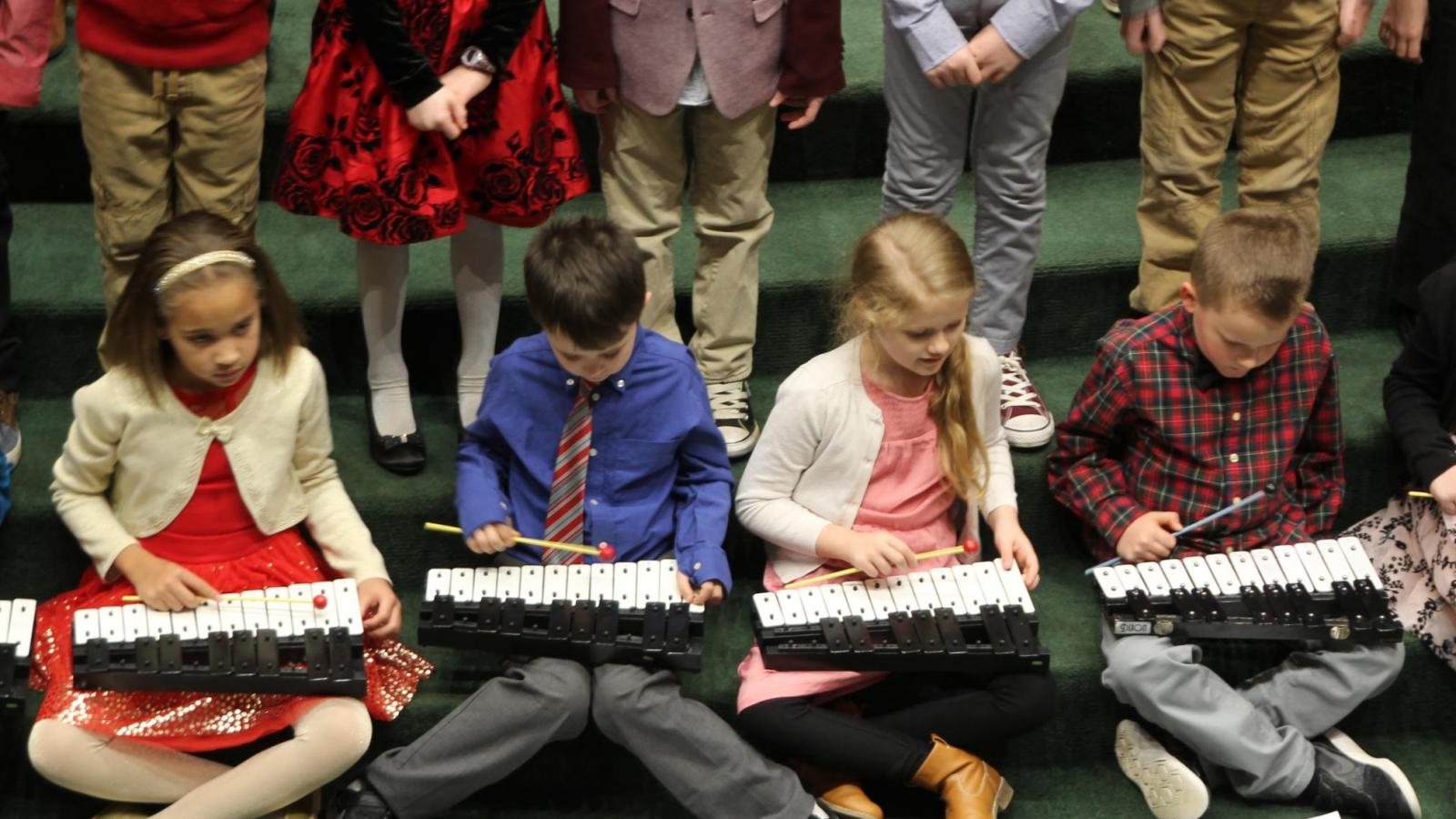 Students playing xylophones