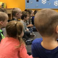 amazed children watching science experiment